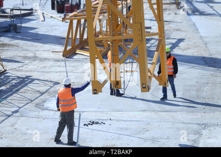 Bucharest, Romania - March 19, 2019: Workers on a construction site Stock Photo