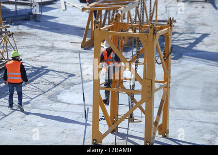 Bucharest, Romania - March 19, 2019: Workers on a construction site Stock Photo