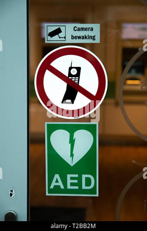 Three Stickers On A Glass Door At Amsterdam The Netherlands 2019 Stock Photo