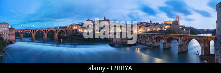 Albi, France. Panoramic cityscape at dusk made from bank of Tarn river Stock Photo