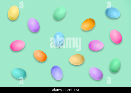 Pastel colored Easter eggs on green background, Easter pattern Stock Photo