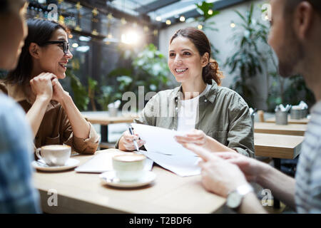 Cheerful startuppers working on new project Stock Photo