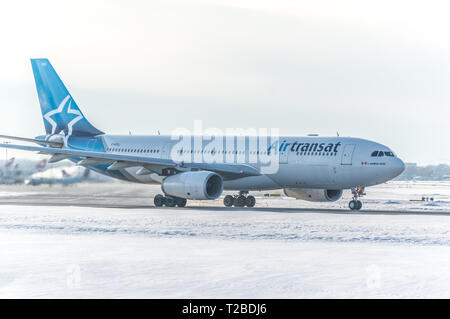 Montreal, Canada- January 20, 2019: Airbus 330 of Airtransat above the Trudeau airport in Canada. Stock Photo