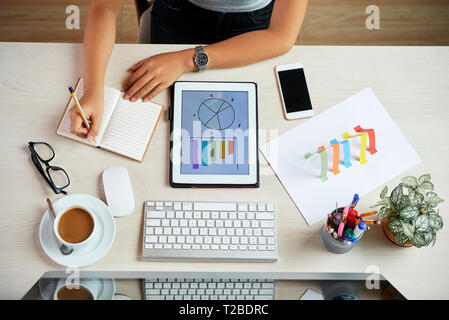 Bsinesswoman making report Stock Photo