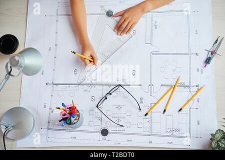 Working on construction plan Stock Photo