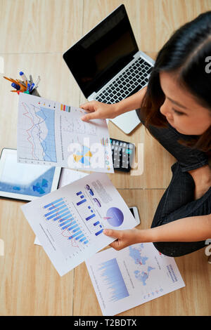 Businesswoman analyzing documents Stock Photo