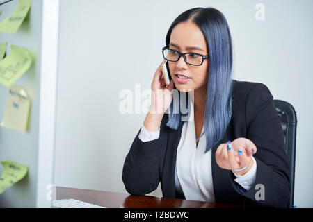 Business lady talking on phone Stock Photo