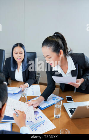 Discussing financial statistics Stock Photo