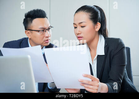 Business people checking documents Stock Photo