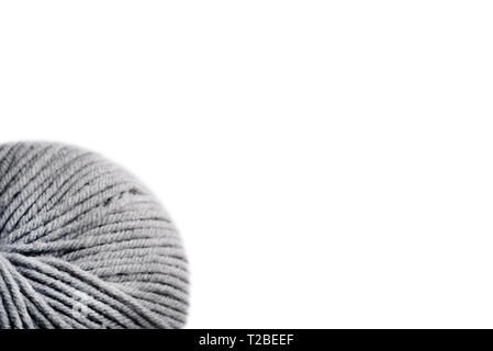 gray woolen threads on white background, copy space Stock Photo