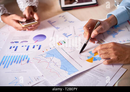 Business executives discussing company activity Stock Photo