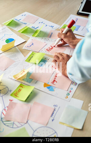 Hands of businesswoman busy with paperwork Stock Photo