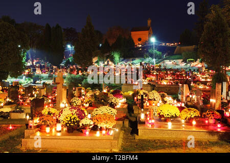 Cemetery at night with many graves and church Stock Photo