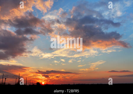 Red sunset sky with dramatic clouds Stock Photo - Alamy