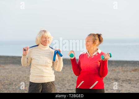two senior women workout outdoor Stock Photo