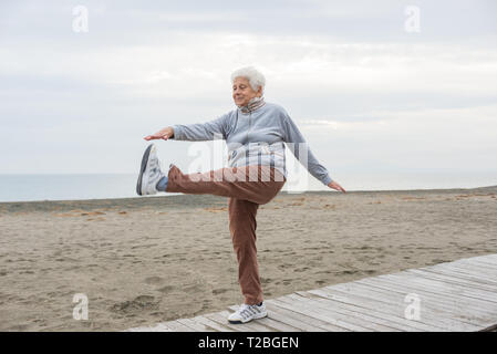 senior woman exercising outdoor Stock Photo