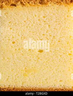 Sponge cake macro vertical shot with texture background Stock Photo