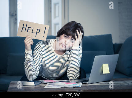 Portrait of worried young woman feeling stressed and desperate asking for help in paying bills, debts, tax expenses and accounting home finances with  Stock Photo