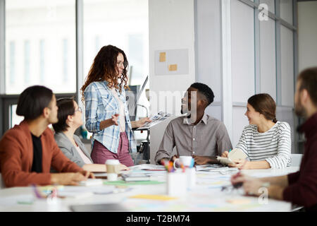 Portrait of creative multi-ethnic team collaborating on project during meeting in office, copy space Stock Photo