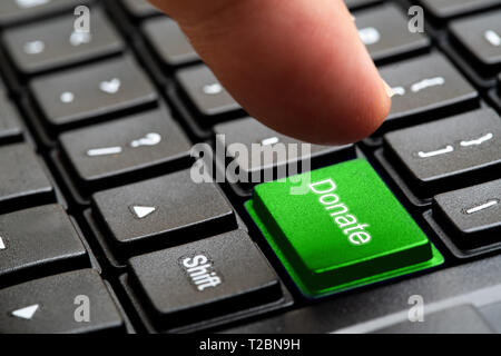 Donate button on keyboard, selective focus , concept word Stock Photo