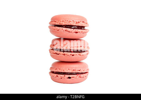 Three pink strawberry macaroons stack on top of each other isolated on white background, no shadow Stock Photo