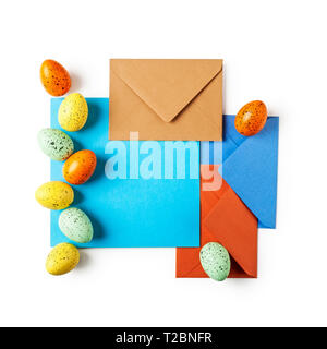 Easter greeting card with eggs, note paper and envelopes. Holiday composition isolated on white background clipping path included. Spring arrangement  Stock Photo