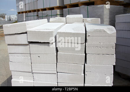 Aerated concrete blocks on pallets stored at warehouse Stock Photo
