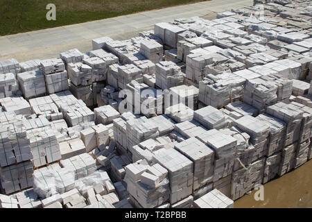 Aerial view of autoclaved aerated concrete blocks, both defective and good, on pallets, stored at factory warehouse Stock Photo
