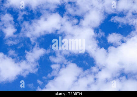 Blue sky fluffy white clouds Stock Photo