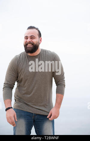 Cheerful middle-eastern young man taxi driver looking at back seat and  smiling at camera, closeup photo, copy space. Happy arab guy enjoying his  brand Stock Photo - Alamy