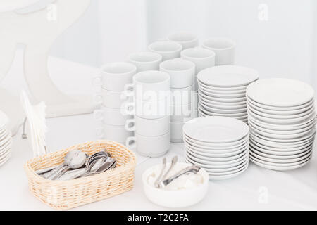 White ceramic mugs. Group of empty coffee cups. White cup for service tea or coffee in breakfast or buffet and seminar event Stock Photo