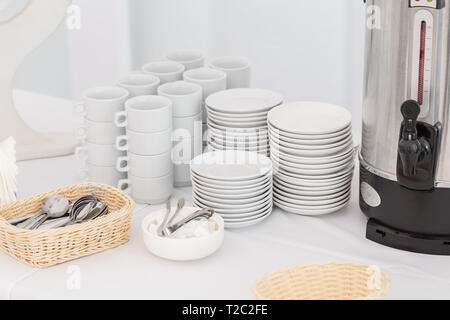 White ceramic mugs. Group of empty coffee cups. White cup for service tea or coffee in breakfast or buffet and seminar event Stock Photo