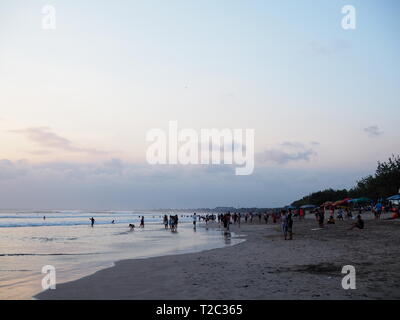 Surfing and sunset on Kuta Beach, Bali, Indonesia Stock Photo