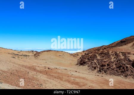 Desert like Landscape above the clouds on the slopes of the Teide Mountain, Tenerife, Canary Islands, Spain Stock Photo