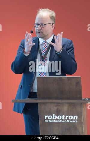 Dresden, Germany. 01st Apr, 2019. Ulf Heinemann, member of the Robotron management board, speaks on the occasion of the opening of the Robotron Museum. Founded on 1 April 1969 as VEB Kombinat Robotron, the company celebrated its 50th anniversary on the same day. Credit: Sebastian Kahnert/dpa-Zentralbild/dpa/Alamy Live News Stock Photo