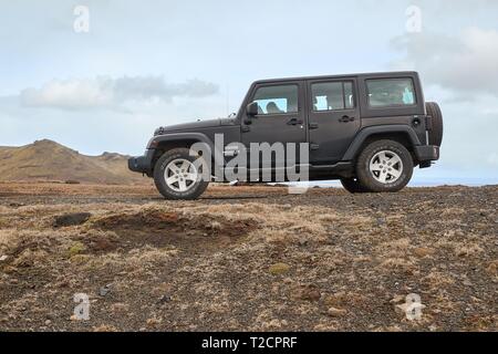 Car on Icelandic terrain, Jeep Wrangler Stock Photo