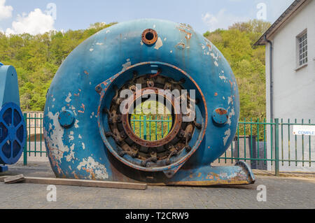 BARRAGE DE NISRAMONT, LA ROCHE-EN-ARDENNE, BELGIUM - APRIL 23, 2011: A part of an old pump is displayed at the Barrage de Nisramont, the dam in the ri Stock Photo