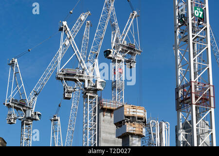 Many construction tower cranes at construction site of redevelopment of St James Centre in Edinburgh, Scotland UK Stock Photo