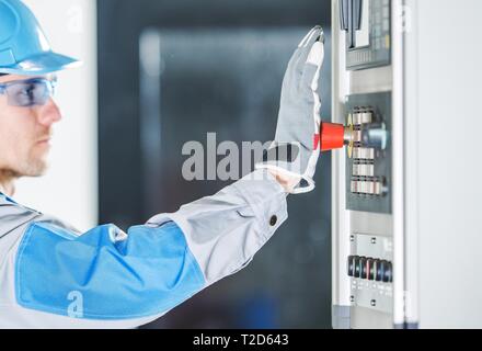 Emergency Machinery Red Stop Button. Working Safety Features. Stock Photo