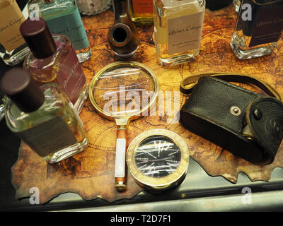 vintage travel concept. old style compass, binoculars magnifying glass and pipe on an old map Stock Photo
