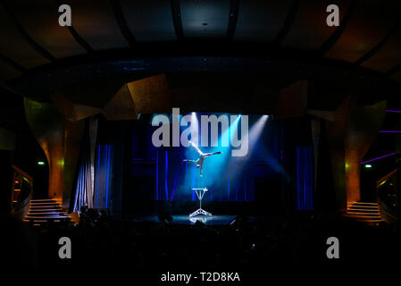 Acrobat performing on stage Stock Photo