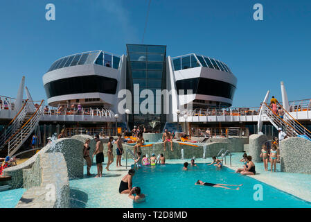 People enjoying the swimming pool on the cruise ship MSC Splendida Stock Photo