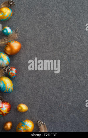 Perfect colorful handmade easter eggs on gray textile background , shape of border frame corner with copy space for text content , happy easter card Stock Photo