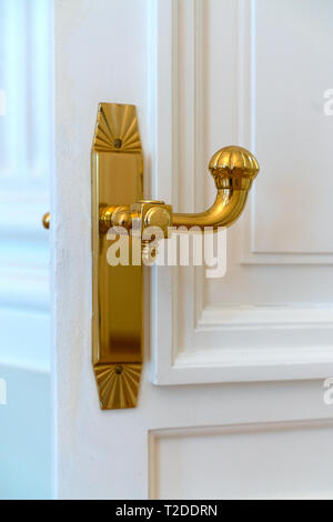 Gold-plated vintage door handle Stock Photo