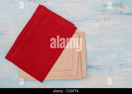 Red and white canvas napkins on the table. Stock Photo