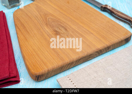Wooden oak cutting board. Kitchenware. Copy space. Stock Photo