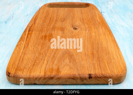 Wooden oak cutting board. Kitchenware. Copy space. Stock Photo