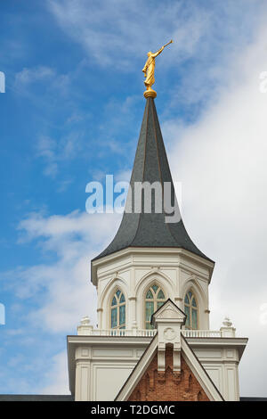 The golden statue of the angel Moroni stands on top of the Provo City Center Temple of the Church of Jesus Christ of Latter-day Saints in Provo, Utah. Stock Photo