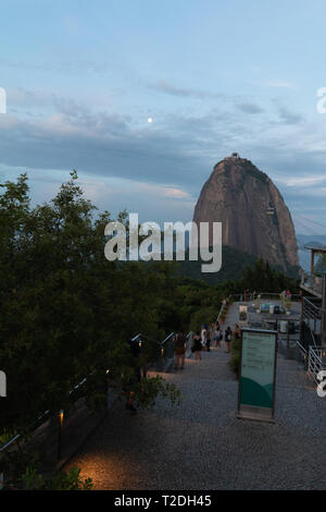 Rio de Janeiro, RJ / Brasil - 03/18/2019: Tourists visiting the Sugar Loaf  at sunset. Stock Photo