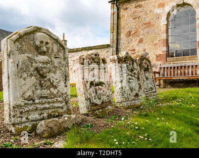 12th century Morham Parish Church and old gravestones with skull and crossbones, East Lothian, Scotland, UK Stock Photo